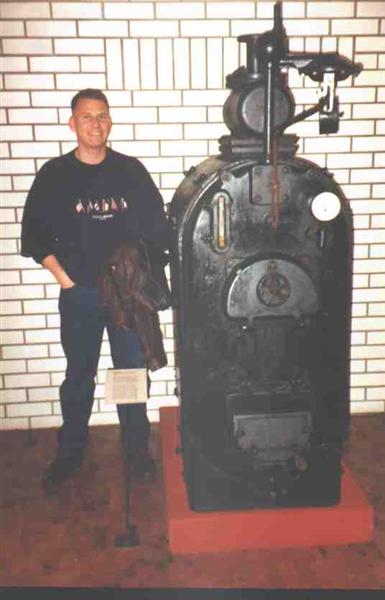 Picture of man next to boiler